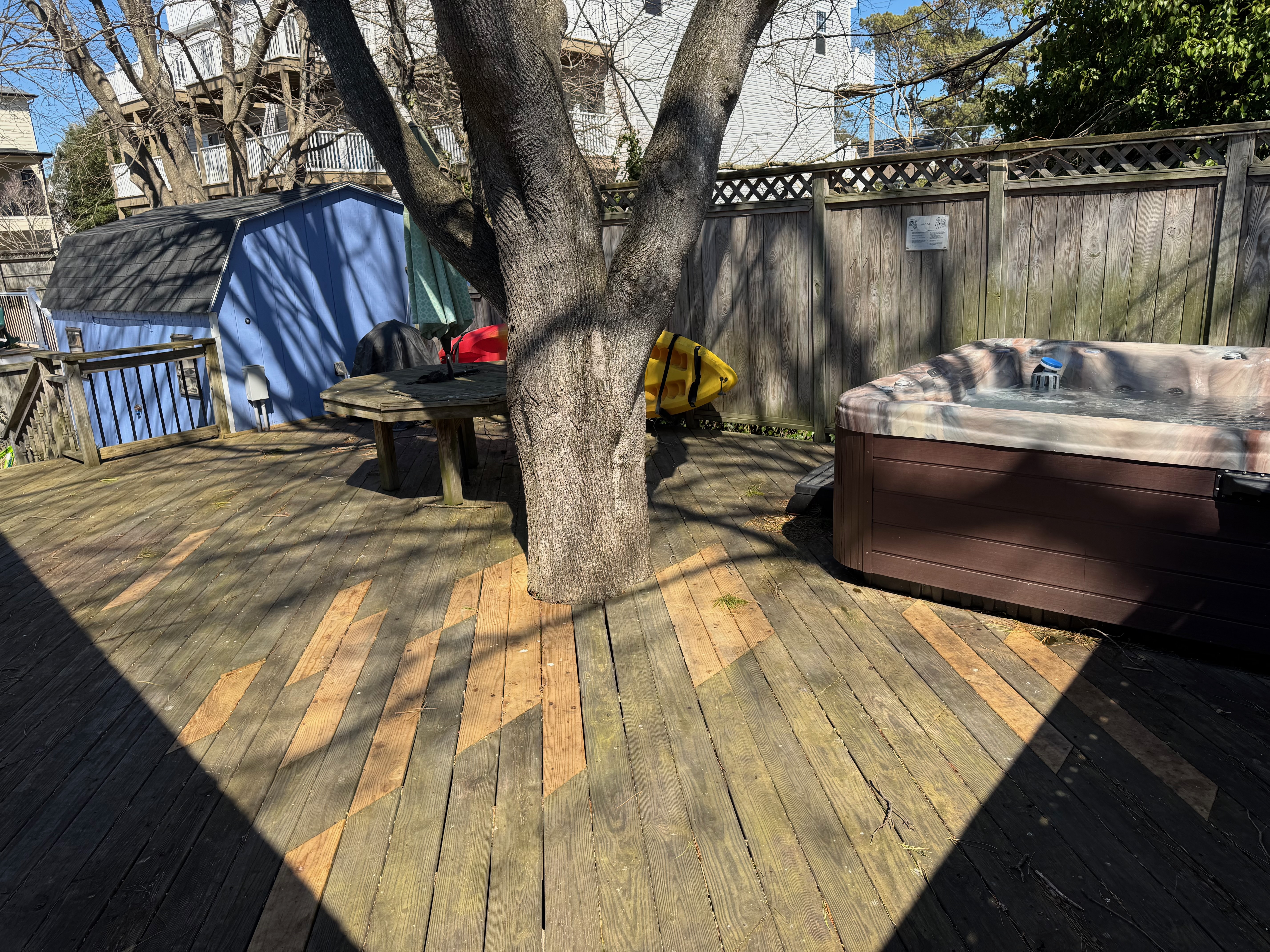 Back deck with hot tub and picnic table